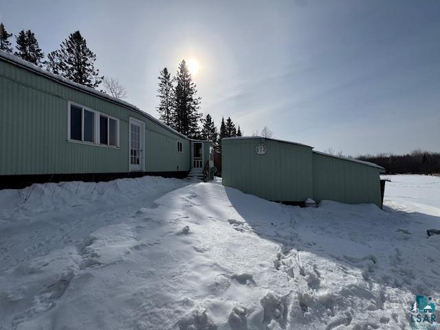 view of snow covered property