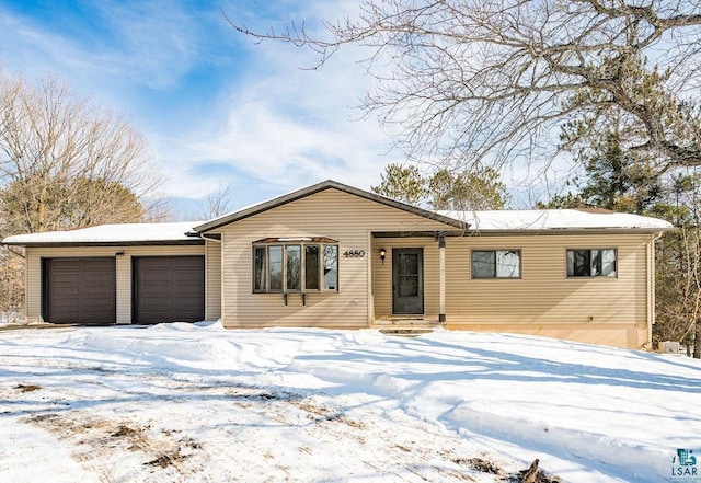 ranch-style home with entry steps and a garage