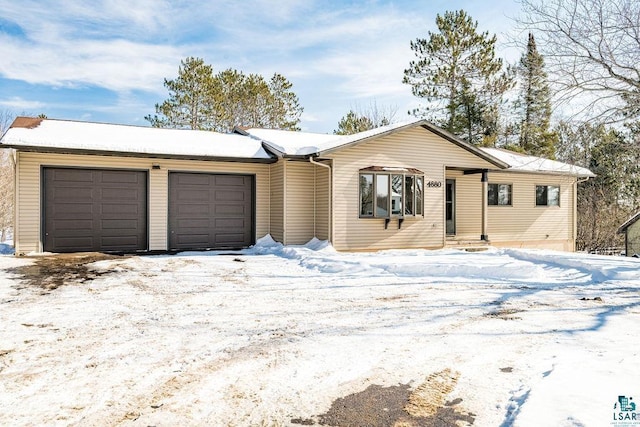 single story home with a garage