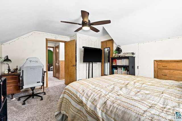 bedroom with lofted ceiling, a ceiling fan, and light colored carpet