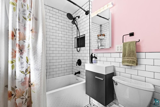 bathroom featuring shower / bath combo, tile walls, toilet, and vanity