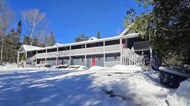 view of front facade with a porch and stairway