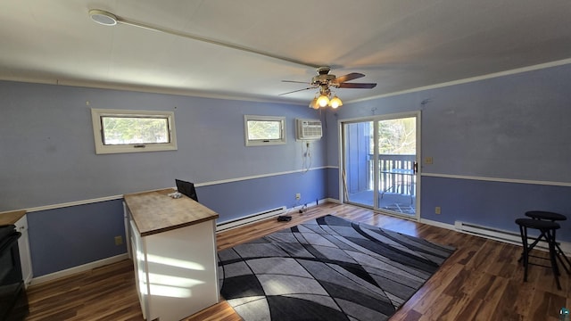 bedroom with a baseboard heating unit, access to outside, dark wood-style flooring, and multiple windows