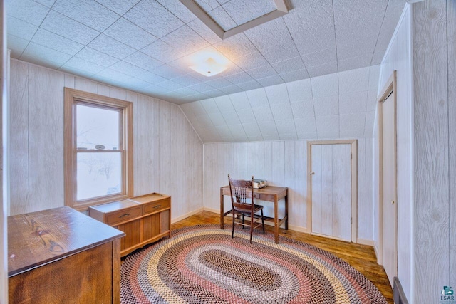 home office featuring vaulted ceiling and wood finished floors