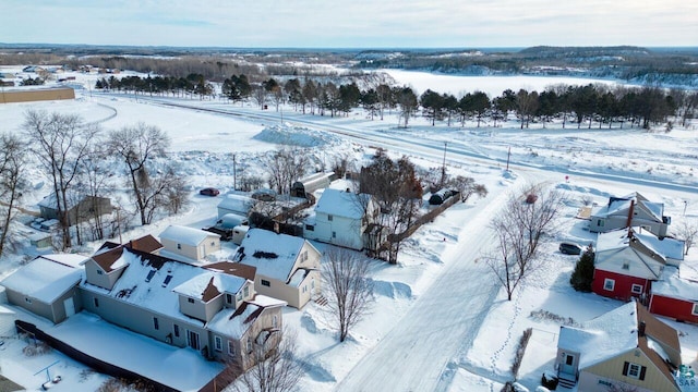 snowy aerial view with a residential view