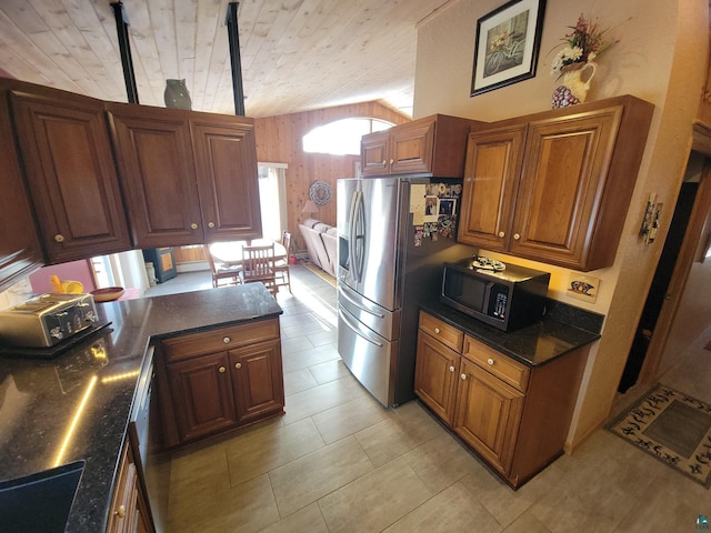 kitchen with vaulted ceiling, stainless steel refrigerator with ice dispenser, wood ceiling, and brown cabinets