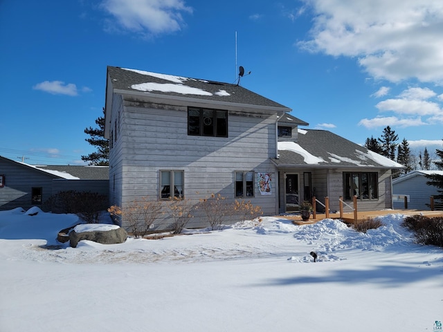 view of snow covered house