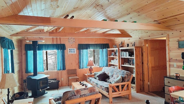 95173 Trapper Shack Bay, Tower, MN 55790 - living area featuring wooden walls, a wood stove, and wood ceiling