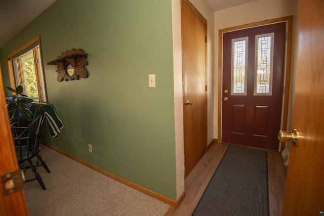 foyer entrance featuring baseboards