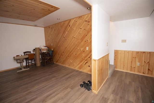 office with recessed lighting, dark wood-style flooring, and wood walls