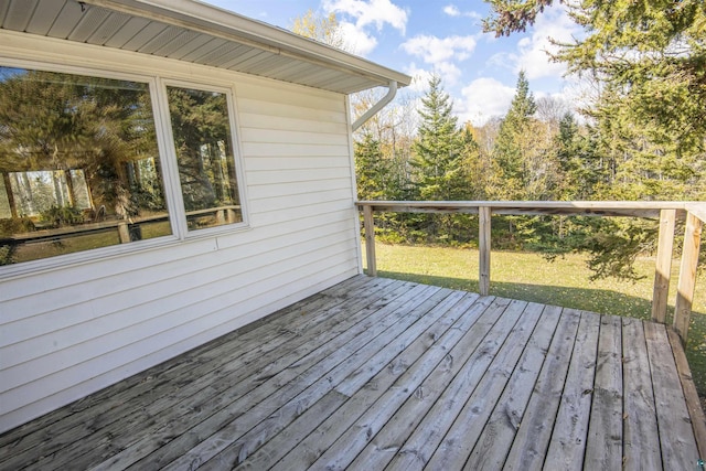 wooden deck with a yard