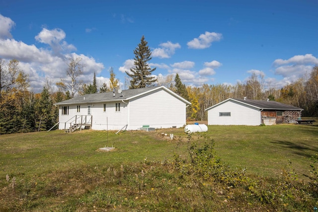 rear view of house with a yard