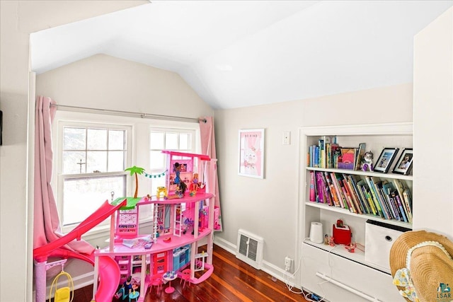 recreation room with lofted ceiling, baseboards, visible vents, and dark wood-style flooring