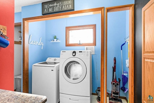 clothes washing area with laundry area and independent washer and dryer