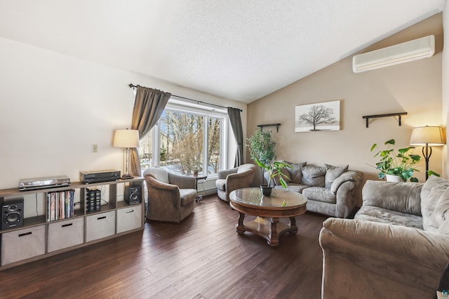 living room featuring lofted ceiling, a textured ceiling, a wall mounted air conditioner, and wood finished floors