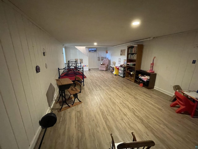 recreation room with recessed lighting, wood finished floors, and baseboards