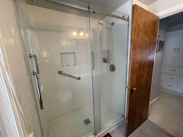 bathroom with a shower stall