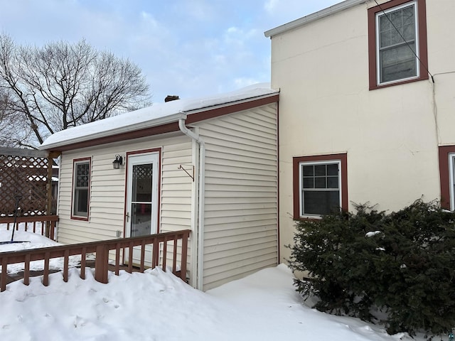 view of snow covered property entrance