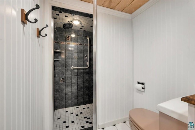 full bath with toilet, a shower stall, and ornamental molding