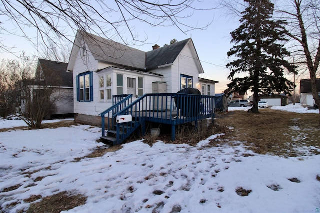 exterior space featuring a deck and a chimney