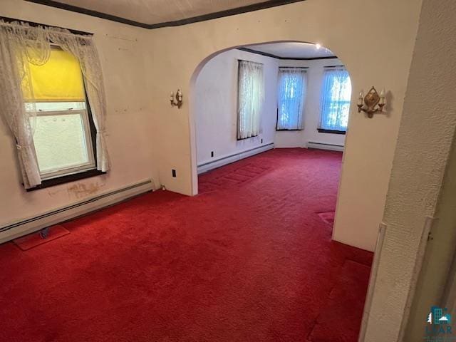 spare room with arched walkways, a baseboard radiator, carpet floors, baseboard heating, and crown molding