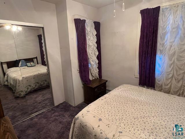 bedroom featuring carpet and a ceiling fan