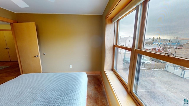 bedroom featuring baseboards