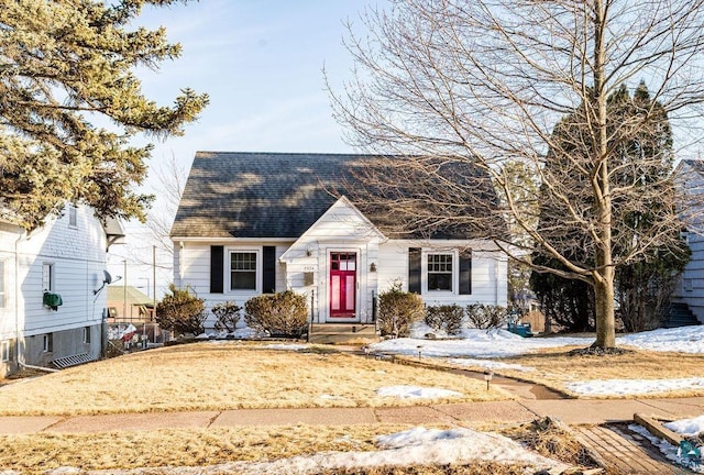 cape cod home with roof with shingles