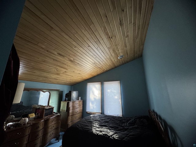 bedroom with lofted ceiling, multiple windows, and wood ceiling