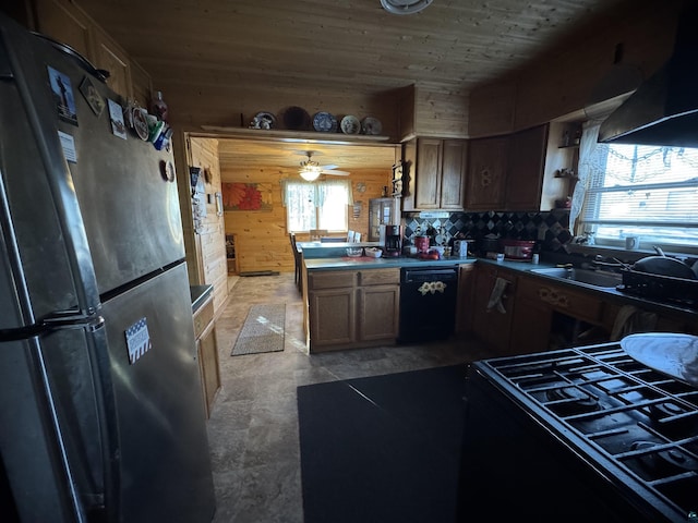 kitchen featuring wooden ceiling, a peninsula, freestanding refrigerator, dishwasher, and range with gas cooktop