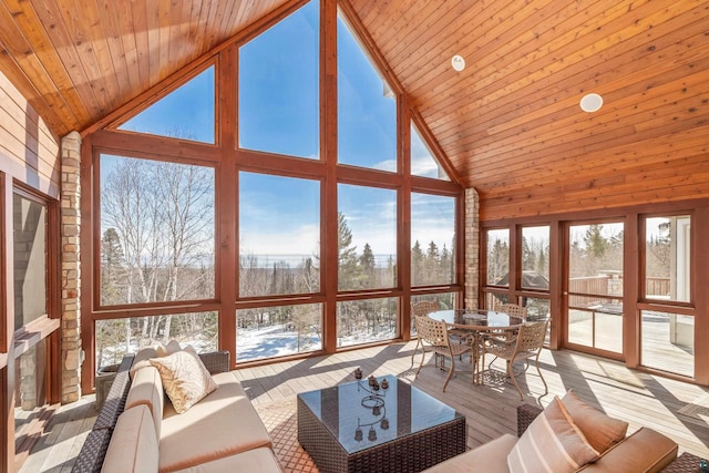 sunroom with lofted ceiling and wooden ceiling