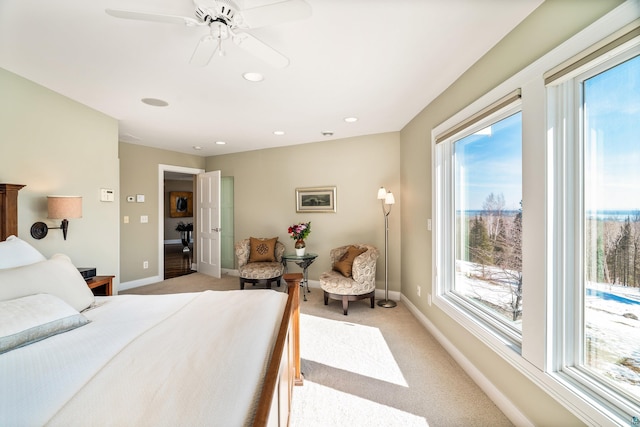 bedroom featuring light carpet, baseboards, and recessed lighting