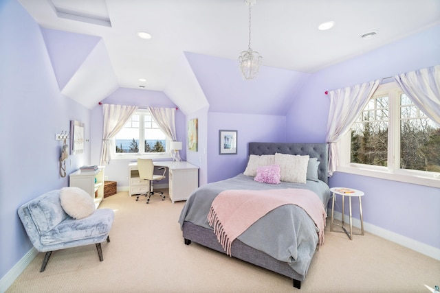 bedroom with lofted ceiling, light carpet, and baseboards