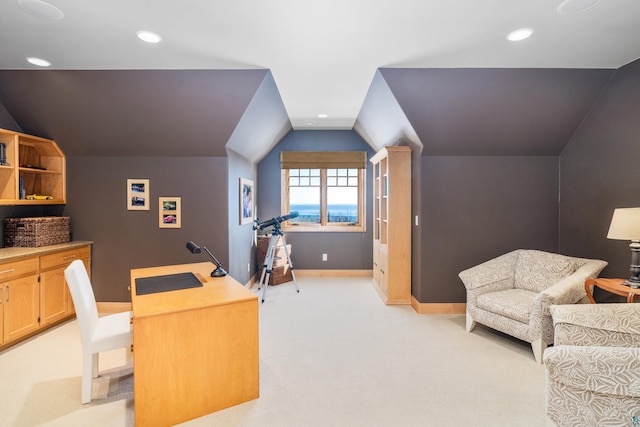 office space with lofted ceiling, recessed lighting, baseboards, and light colored carpet