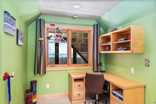 home office featuring lofted ceiling