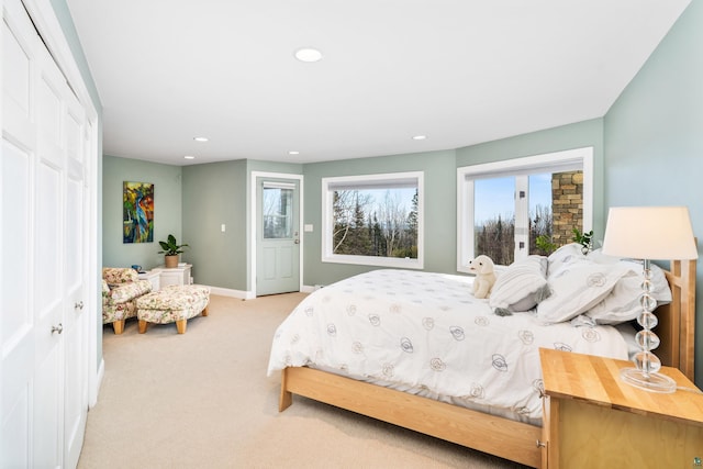 carpeted bedroom featuring baseboards, a closet, and recessed lighting