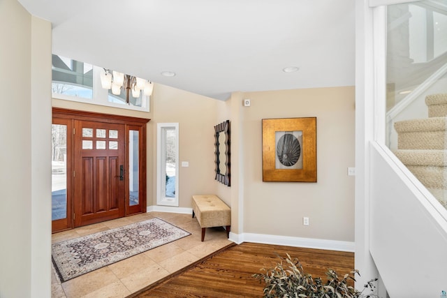 entrance foyer featuring stairs, recessed lighting, wood finished floors, and baseboards