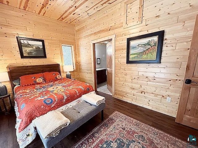 bedroom with wooden ceiling, dark wood-style floors, ensuite bath, and wooden walls