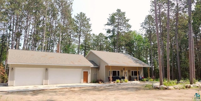 ranch-style house with driveway and an attached garage