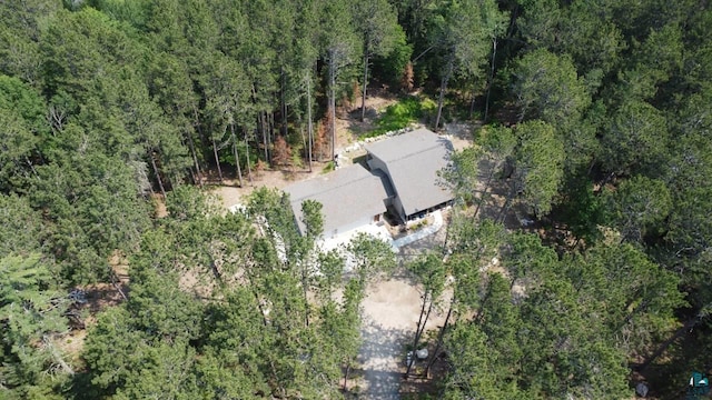 drone / aerial view featuring a forest view