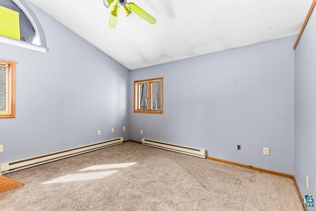 carpeted empty room with a baseboard heating unit, vaulted ceiling, a textured ceiling, and ceiling fan