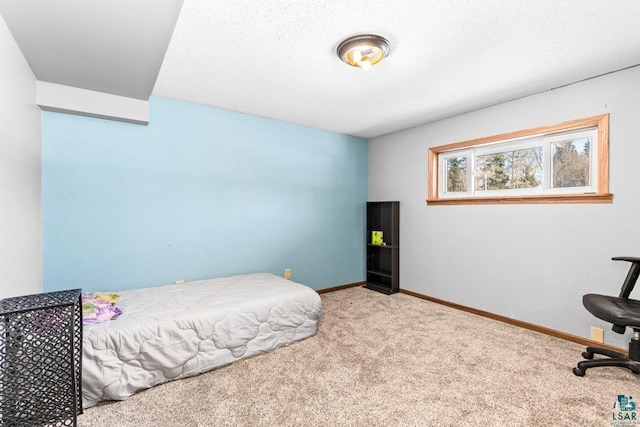 carpeted bedroom featuring baseboards