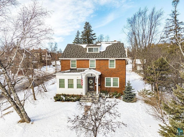 view of front of home featuring brick siding