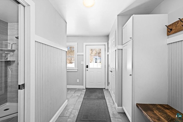 mudroom with a wainscoted wall