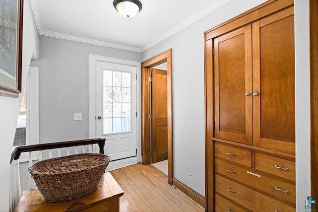 doorway with ornamental molding and light wood-type flooring