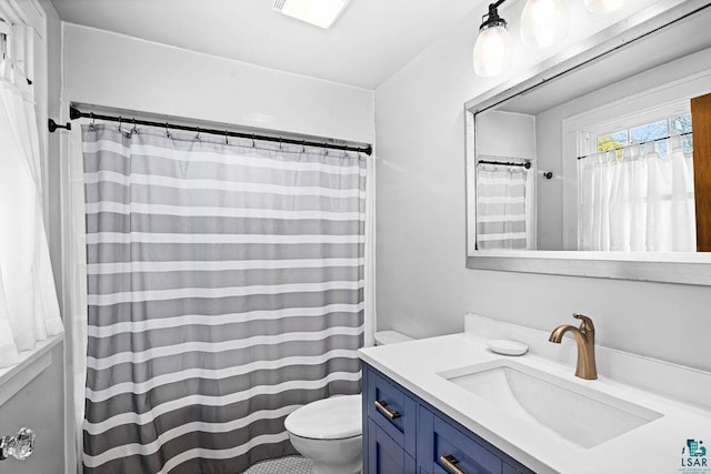 full bathroom with toilet, a shower with shower curtain, and vanity