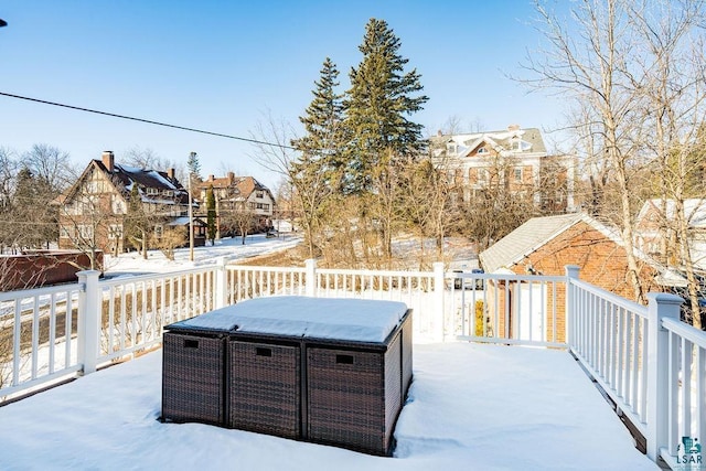 yard covered in snow with a residential view