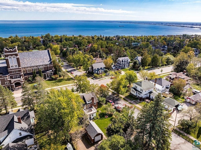 bird's eye view with a water view and a residential view