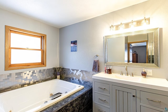 bathroom featuring a jetted tub and vanity