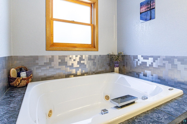 bathroom with a jetted tub